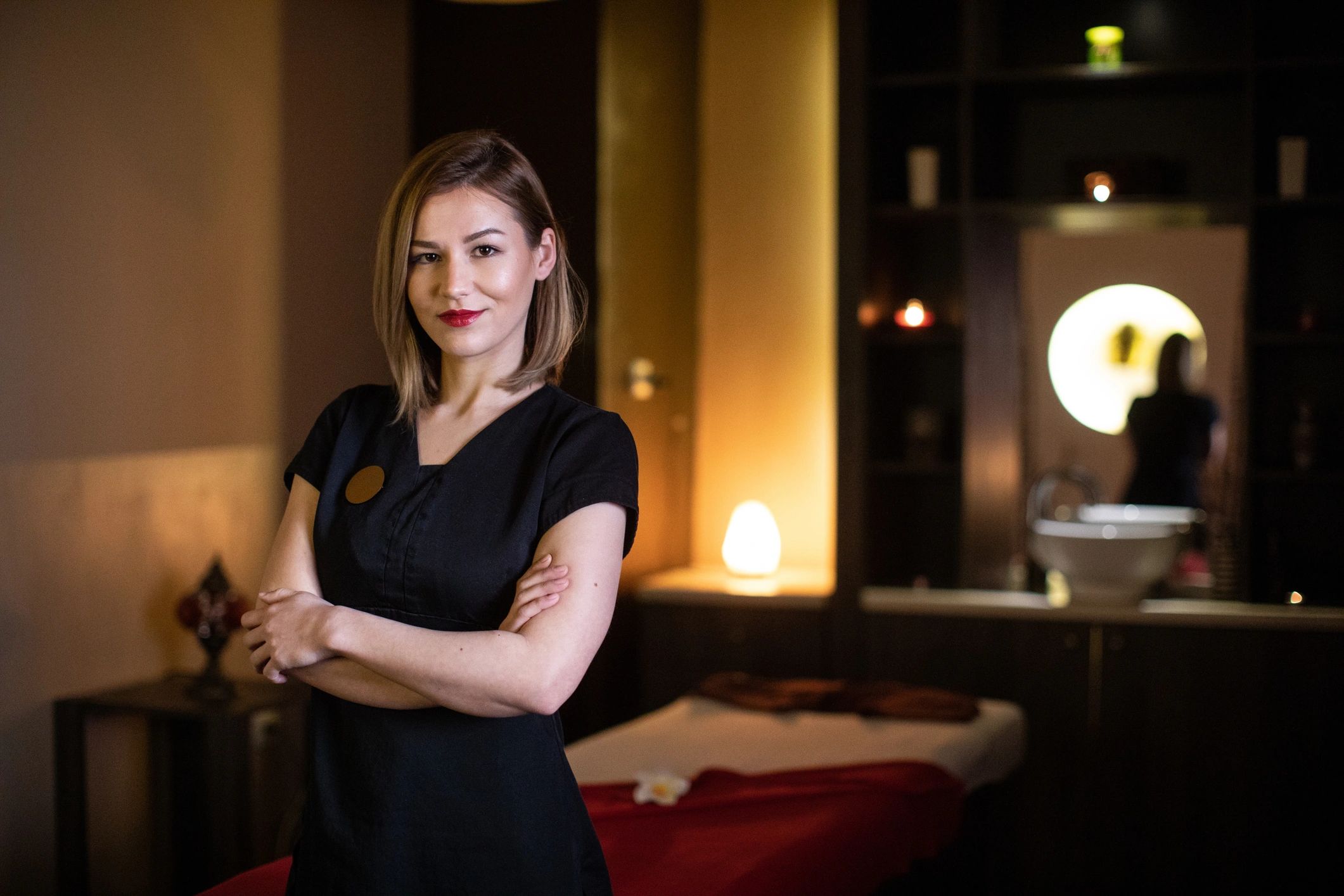 Professional spa therapist in a calm treatment room